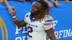 Ashton Jeanty #2 of the Boise State Broncos high fives fans following the Vrbo Fiesta Bowl against the Penn State Nittany Lions at State Farm Stadium on December 31, 2024 in Glendale, Arizona. The Nittany Lions defeated the Broncos 31-14.