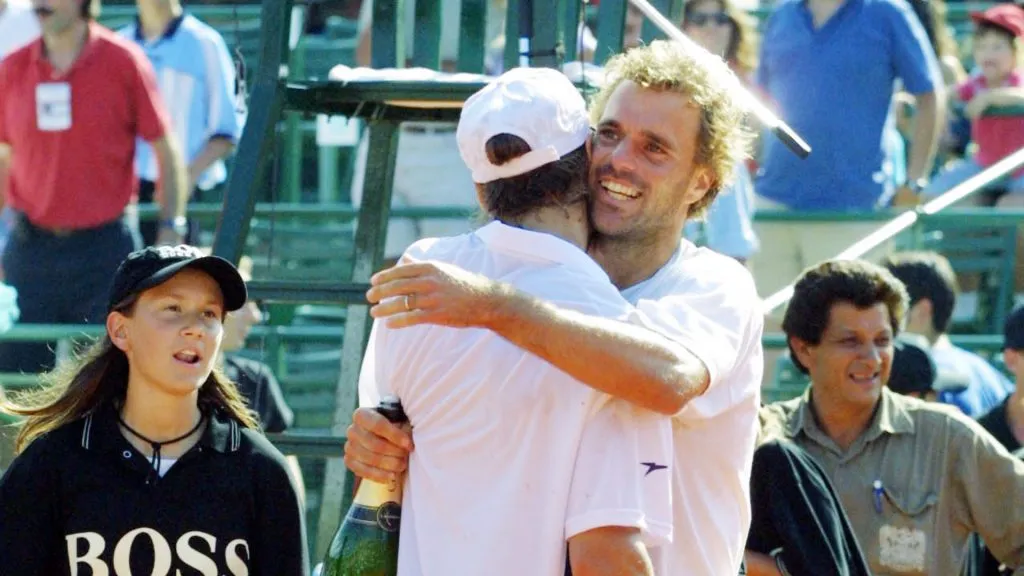 Lucas Arnold (R) and Gaston Gaudio of Argentina embrace each other after sweeping Australia during the Davis Cup (Ronald Martinez/Getty Images)