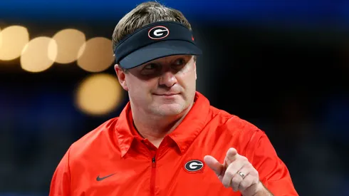 Georgia Bulldogs head coach Kirby Smart holds the championship trophy after the Chick-fil-A Peach Bowl win against the Cincinnati Bearcats at Mercedes-Benz Stadium on January 01, 2021 in Atlanta, Georgia.