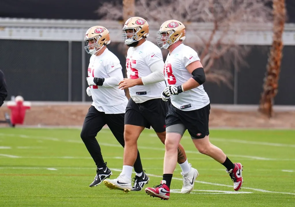 LAS VEGAS, NEVADA – FEBRUARY 09: Corey Luciano #61, Matt Pryor #75 and Ben Bartch #78 participate during San Francisco 49ers practice ahead of Super Bowl LVIII at Fertitta Football Complex on February 09, 2024 in Las Vegas, Nevada. (Photo by Chris Unger/Getty Images)