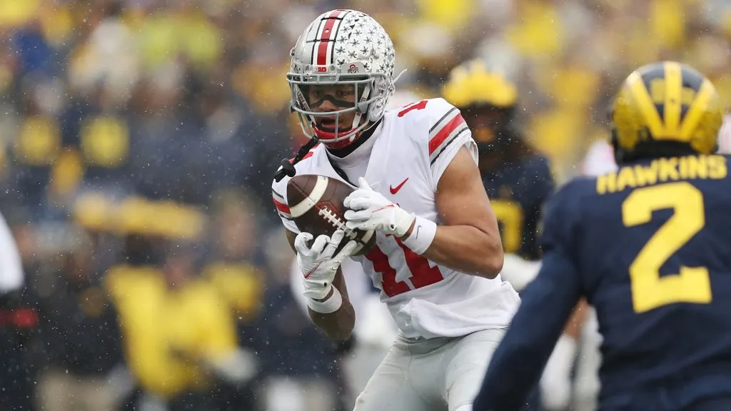 Jaxon Smith-Njigba #11 of the Ohio State Buckeyes catches a pass against the Michigan Wolverines during the second quarter at Michigan Stadium on November 27, 2021 in Ann Arbor, Michigan.