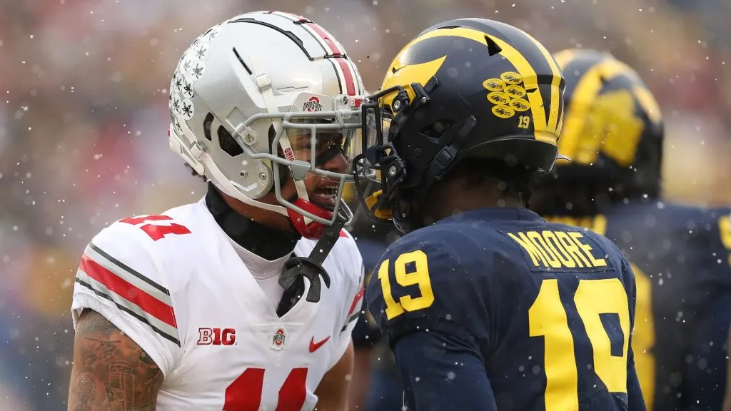 Tempers flare between Jaxon Smith-Njigba #11 of the Ohio State Buckeyes and Rod Moore #19 of the Michigan Wolverines during the first quarter at Michigan Stadium on November 27, 2021 in Ann Arbor, Michigan.