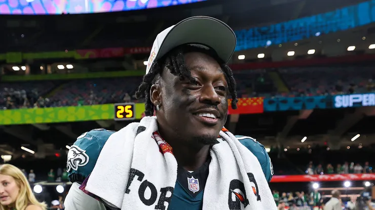 A.J. Brown #11 of the Philadelphia Eagles celebrates with the Vince Lombardi Trophy after beating the Kansas City Chiefs