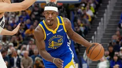 Jimmy Butler III #10 of the Golden State Warriors dribbles the ball to the basket on Dante Exum #0 of the Dallas Mavericks