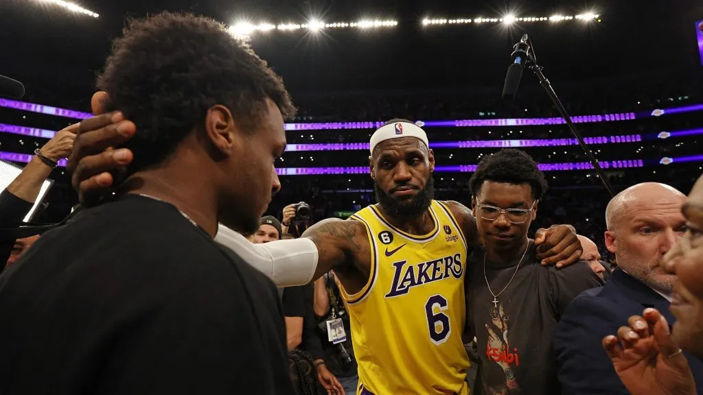 LeBron James #6 of the Los Angeles Lakers reacts with Bronny James and Bryce James after scoring to pass Kareem Abdul-Jabbar to become the NBA’s all-time leading scorer, surpassing Abdul-Jabbar’s career total of 38,387 points against the Oklahoma City Thunder at Crypto.com Arena on February 07, 2023 in Los Angeles, California. (Photo by Harry How/Getty Images)