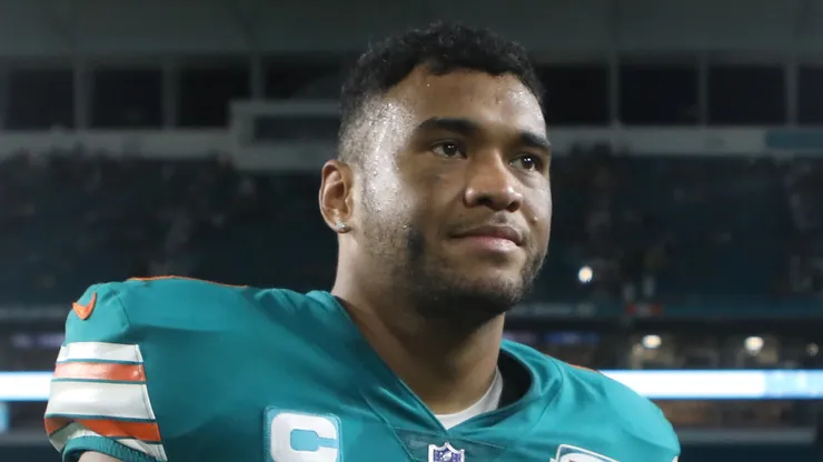 Tua Tagovailoa #1 of the Miami Dolphins walks off the field with the game ball after defeating the Pittsburgh Steelers 16-10 at Hard Rock Stadium on October 23, 2022 in Miami Gardens, Florida.