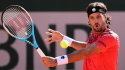Feliciano Lopez plays a backhand in their men's first round match of Roland Garros against Federico Coria.