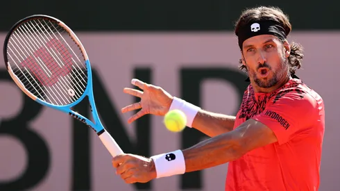 Feliciano Lopez plays a backhand in their men's first round match of Roland Garros against Federico Coria.