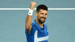 Novak Djokovic of Serbia celebrates winning a match point against Carlos Alcaraz of Spain in the quarterfinal of the 2025 Australian Open.