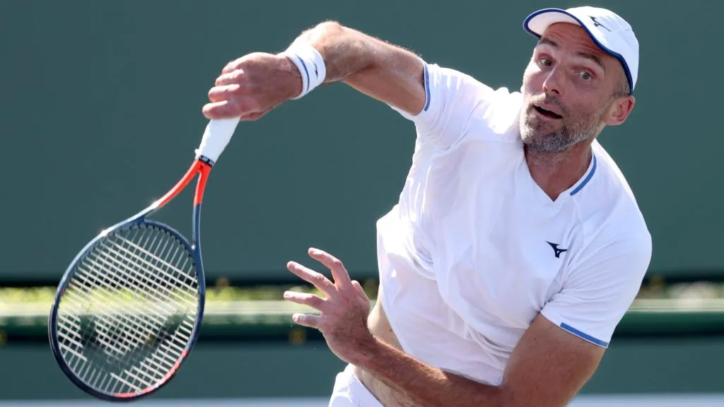 Ivo Karlovic of Croatia serves to Brayden Schnur of Canada during qualifying for the BNP Paribas Open at the Indian Wells Tennis Garden. (Matthew Stockman/Getty Images)