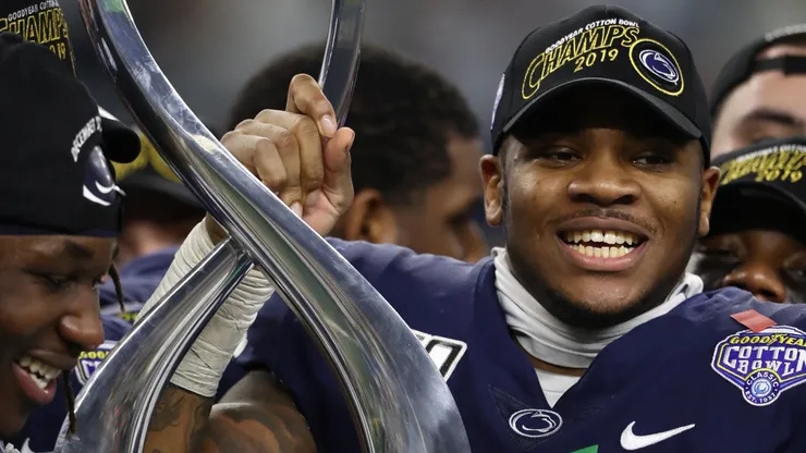Micah Parsons #11 of the Penn State Nittany Lions with the Goodyear Cotton Bowl Classic Championship trophy after a 53-39 win against the Memphis Tigers at AT&T Stadium on December 28, 2019 in Arlington, Texas.