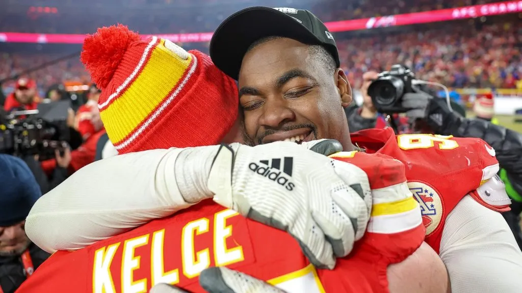 Chris Jones #95 of the Kansas City Chiefs hugs Travis Kelce #87 after defeating the Buffalo Bills 32-29 in the AFC Championship Game at GEHA Field at Arrowhead Stadium on January 26, 2025 in Kansas City, Missouri.