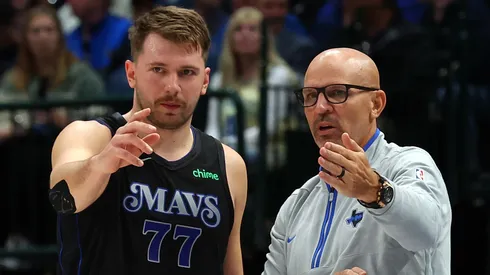 Luka Doncic #77 of the Dallas Mavericks talks with head coach Jason Kidd in the first half of the NBA In-Season Tournament game against the LA Clippers at American Airlines Center.