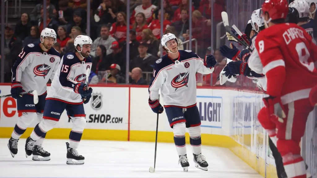 Kent Johnson #91 of the Columbus Blue Jackets celebrates his second period goal with teammates while playing the Detroit Red Wings at Little Caesars Arena on February 27, 2025 in Detroit, Michigan. Columbus won the game 5-2. (Photo by Gregory Shamus/Getty Images)