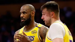 LeBron James #23 and Luka Doncic #77 of the Los Angeles Lakers talk during the third quarter of a game against the Utah Jazz.