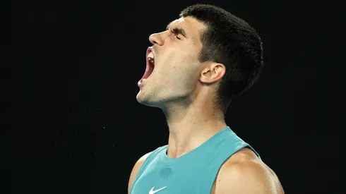 Carlos Alcaraz reacts against Novak Djokovic in the Men's Singles Quarterfinal match during day 10 of the 2025 Australian Open.