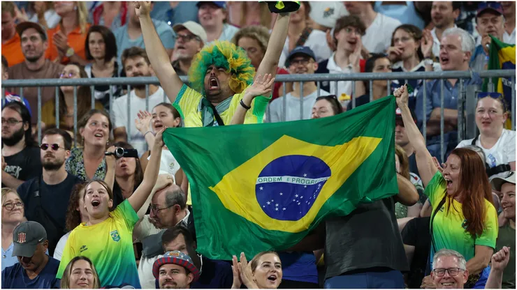 Fans wave a flag of Brazil