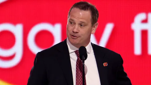 General manager Craig Conroy of the Calgary Flames announces the ninth overall pick during the first round of the 2024 Upper Deck NHL Draft at Sphere on June 28, 2024 in Las Vegas, Nevada.