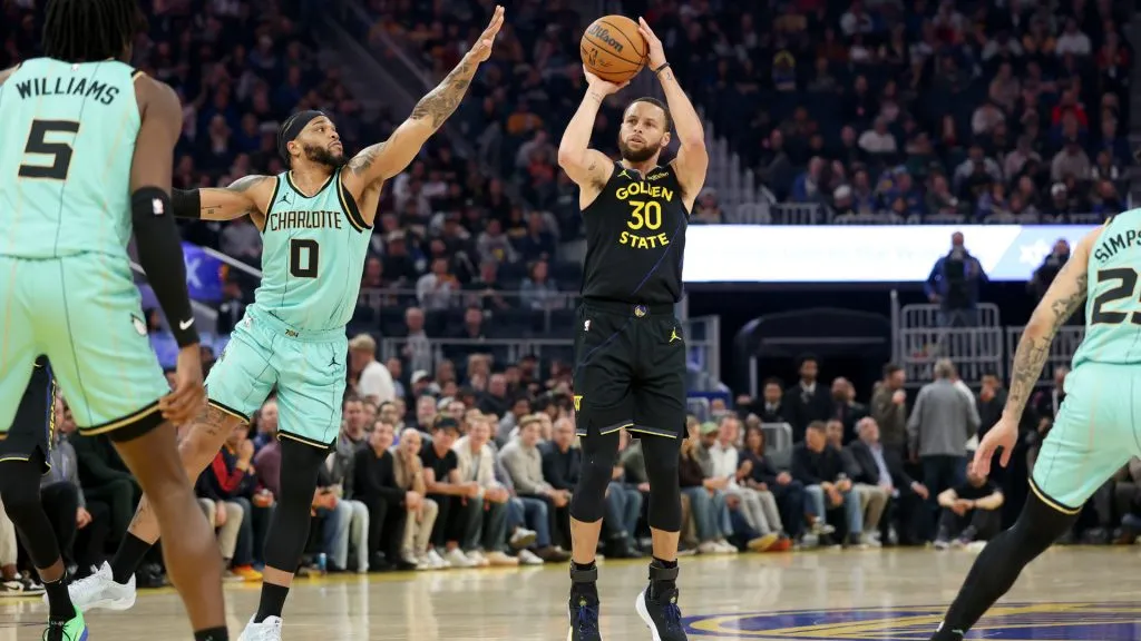 Stephen Curry #30 of the Golden State Warriors shoots over Miles Bridges #0 of the Charlotte Hornets during the first half at Chase Center. (Ezra Shaw/Getty Images)