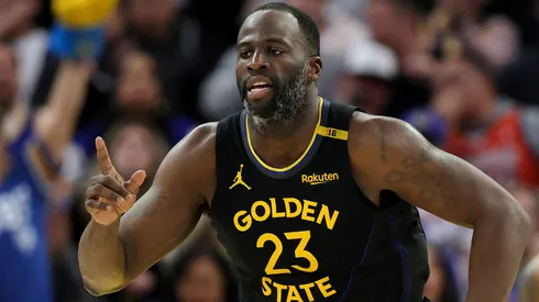 Draymond Green #23 of the Golden State Warriors reacts after the Warriors made a basket against the Charlotte Hornets.