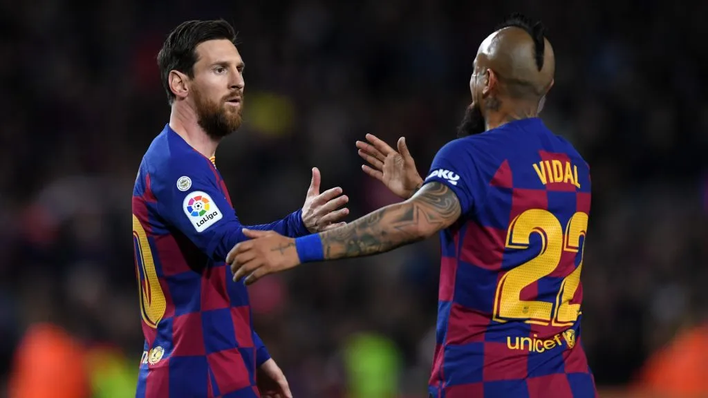Lionel Messi celebrates with Arturo Vidal after scoring his sides first goal during the La Liga match between FC Barcelona and Real Sociedad. (Alex Caparros/Getty Images)