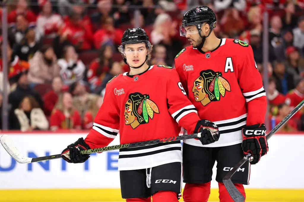 CHICAGO, ILLINOIS – JANUARY 03: Connor Bedard #98 and Seth Jones #4 of the Chicago Blackhawks look on against the Montreal Canadiens during the third period at the United Center on January 03, 2025 in Chicago, Illinois. (Photo by Michael Reaves/Getty Images)