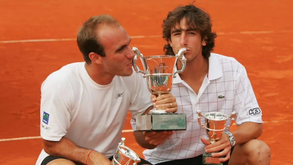 Luis Horna and Pablo Cuevas with the 2008 French Open doubles title (Matthew Stockman/Getty Images)