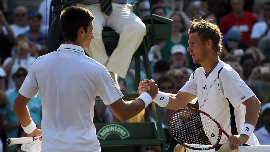 Djokovic and Hewitt after facing at the 2010 Wimbledon Championships (Hamish Blair/Getty Images)