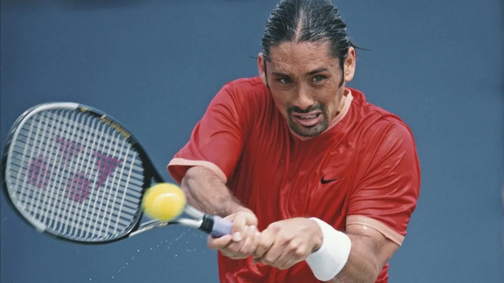 Marcelo Rios of Chile makes a double backhand return to Andrei Pavel during their Men’s Singles second round match at the US Open Tennis Championship in 2001. (Source: Clive Brunskill/Getty Images)