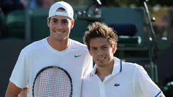 John Isner of the United States (L) and Nicolas Mahut of France pose before their first round match on Day Two of the Wimbledon Lawn Tennis Championships in 2011.