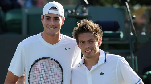 John Isner of the United States (L) and Nicolas Mahut of France pose before their first round match on Day Two of the Wimbledon Lawn Tennis Championships in 2011.