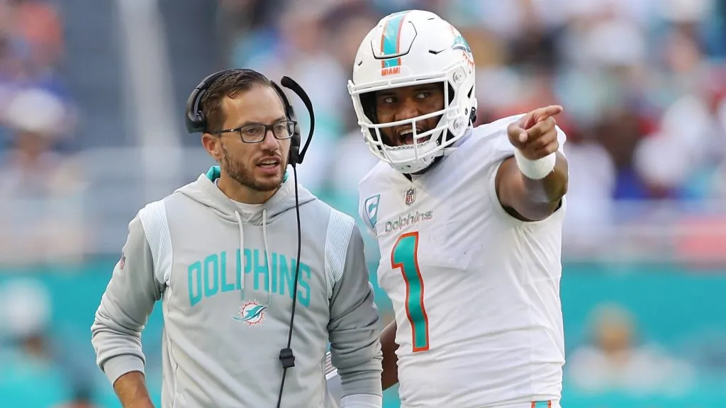 Head coach Mike McDaniel speaks with quarterback Tua Tagovailoa #1 of the Miami Dolphins in the fourth quarter of the game against the Buffalo Bills in 2022. (Source: Megan Briggs/Getty Images)