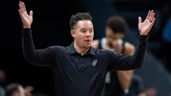 Interim head coach Mitch Johnson of the San Antonio Spurs looks on in the second quarter during their game against the Charlotte Hornets at Spectrum Center on February 07, 2025 in Charlotte, North Carolina.