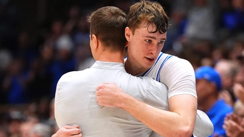 Head coach Jon Scheyer of the Duke Blue Devils embraces Cooper Flagg #2 during the second half against the Wake Forest Demon Deacons at Cameron Indoor Stadium on March 03, 2025 in Durham, North Carolina.
