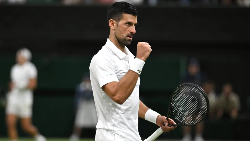 Novak Djokovic of Serbia celebrates winning match point with against Holger Rune of Denmark in a 2024 Wimbledon match. (Mike Hewitt/Getty Images)