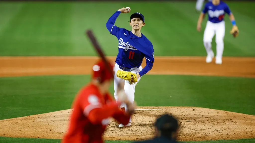 Roki Sasaki #11 of the Los Angeles Dodgers throws a pitch in the sixth inning during a spring training game against the Cincinnati Reds at Camelback Ranch on March 4, 2025 in Glendale, Arizona. (Photo by Brandon Sloter/Getty Images)