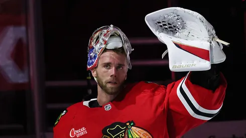 Spencer Knight #30 of the Chicago Blackhawks waves as he is acknowledged after the game against the Los Angeles Kings at the United Center on March 03, 2025 in Chicago, Illinois.