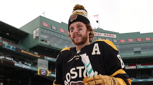 David Pastrnak #88 of the Boston Bruins walks to the ice to practice for the 2023 Winter Classic at Fenway Park on January 01, 2023 in Boston, Massachusetts.