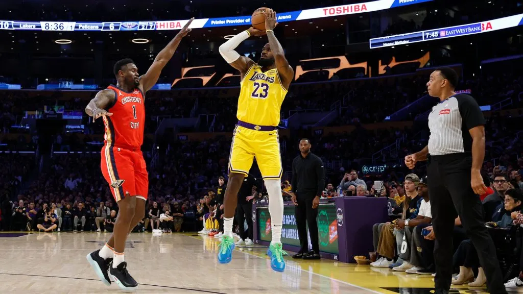 LeBron James #23 of the Los Angeles Lakers shoots a 3-point basket to score his 50,002 NBA regular season and playoff career points. (Ronald Martinez/Getty Images)