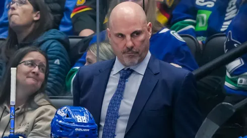 Vancouver Canucks head coach Rick Tocchet looks on during the third period of their NHL game against the Calgary Flames at Rogers Arena on October 9, 2024 in Vancouver, British Columbia, Canada.