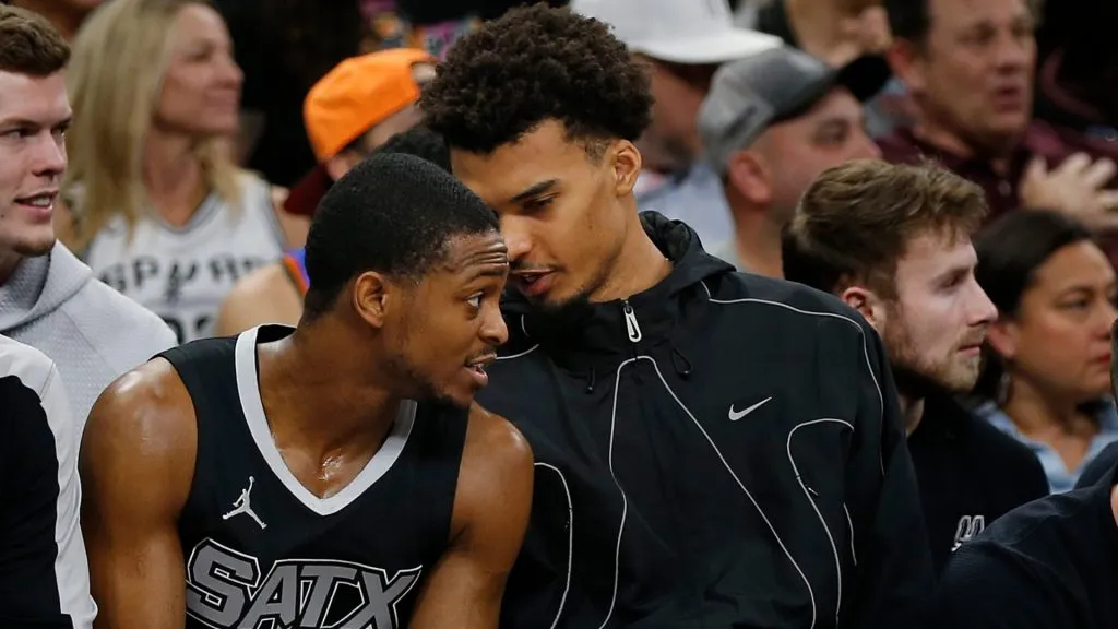 Victor Wembanyama (R) #1 of the San Antonio Spurs talks with teammate De’Aaron Fox #4 during the game against Oklahoma City Thunder in the first half at Frost Bank Center on March 2, 2025 in San Antonio, Texas. (Photo by Ronald Cortes/Getty Images)