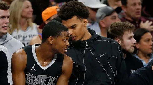 Victor Wembanyama (R) #1 of the San Antonio Spurs talks with teammate De'Aaron Fox #4 during the game against Oklahoma City Thunder in the first half at Frost Bank Center on March 2, 2025 in San Antonio, Texas.
