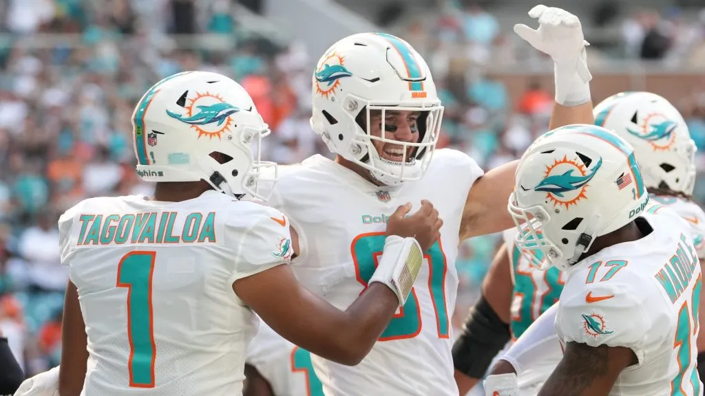 Durham Smythe #81 of the Miami Dolphins celebrates a touchdown with Tua Tagovailoa #1 and Jaylen Waddle #17 during the first quarter in the game against the Houston Texans at Hard Rock Stadium on November 27, 2022 in Miami Gardens, Florida.
