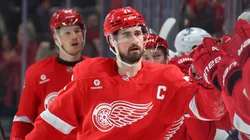 Dylan Larkin #71 of the Detroit Red Wings celebrates his first period goal with teammates while playing the Utah Hockey Club at Little Caesars Arena on March 06, 2025 in Detroit, Michigan.