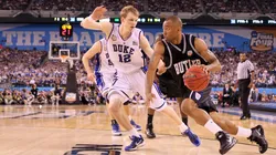 Shawn Vanzant #2 of the Butler Bulldogs drives on Kyle Singler #12 of the Duke Blue Devils in the second half during the 2010 NCAA Division I Men's Basketball National Championship game.