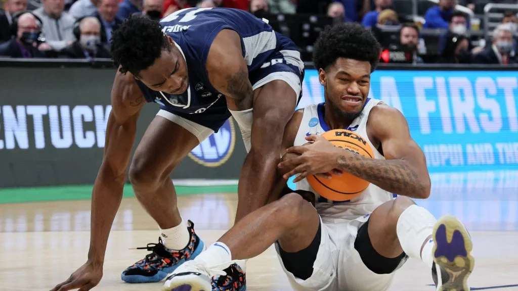 Keion Brooks Jr.  competes for a loose ball against the Saint Peter’s Peacocks during the first half in the first round game of the 2022 NCAA Men’s Basketball Tournament. (Source: Andy Lyons/Getty Images)