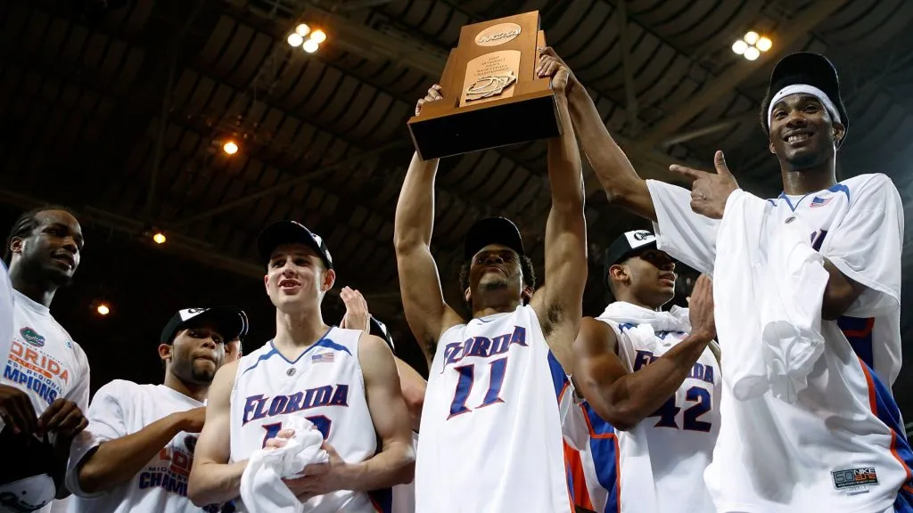 The Florida Gators celebrate defeating the Oregon Ducks in the midwest regionals of the NCAA Men’s Basketball Tournament at the Edward Jones Dome on March 25, 2007. (Source: Dilip Vishwanat/Getty Images)