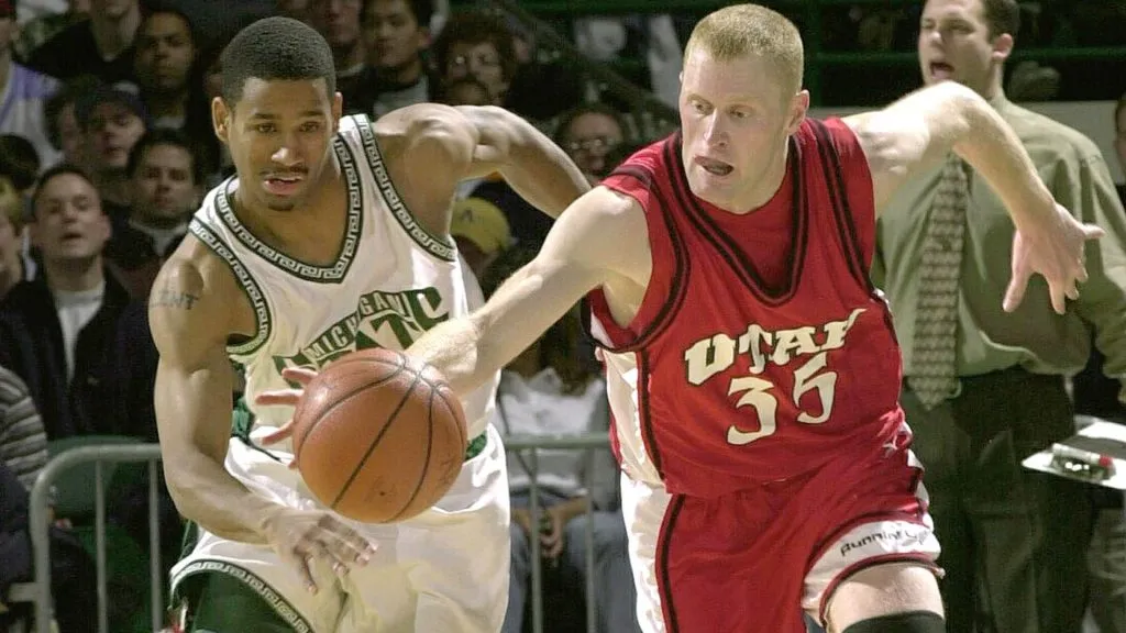 Utah’s Jeff Johnsen, right, reaches for the ball in front of Michigan State’s Seth Black in round two of the Midwest Region of the NCAA Men’s Basketball Championship in 2000. (Source: Doug Pensinger)