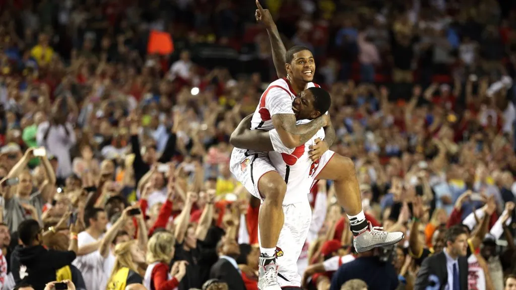 Chane Behanan (top) #21 and Montrezl Harrell #24 of the Louisville Cardinals celebrate after they won 82-76 against the Michigan Wolverines during the 2013 NCAA Men’s Final Four Championship. (Source: Andy Lyons/Getty Images)