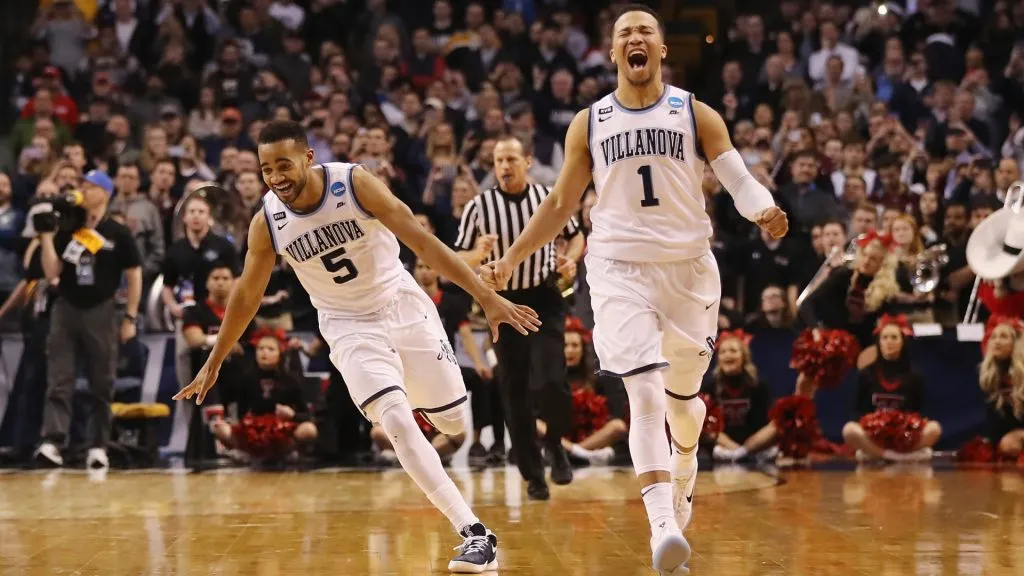 Phil Booth #5 and Jalen Brunson #1 of the Villanova Wildcats celebrate defeating the Texas Tech Red Raiders 71-59 in the 2018 NCAA Men’s Basketball Tournament East Regional. (Source: Elsa/Getty Images)